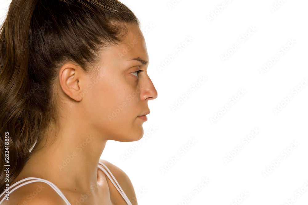 Profile of bautiful young woman without makeup on white background Profile of bautiful young woman without makeup on white background