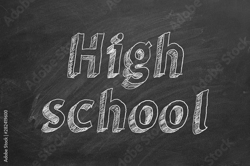 Hand drawing High school on black chalkboard.