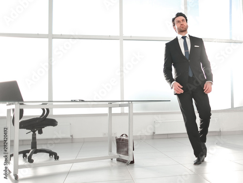 modern businessman standing in a bright office