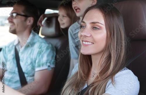 close up. the young woman behind the wheel of the family car