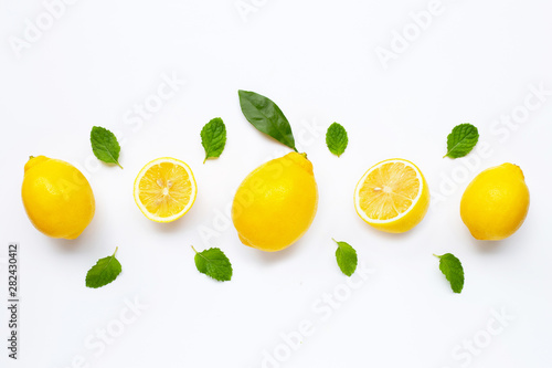 Fresh lemon with mint leaves isolated on white