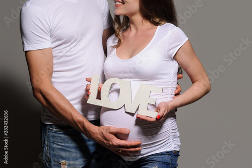 Beautiful young couple expecting baby