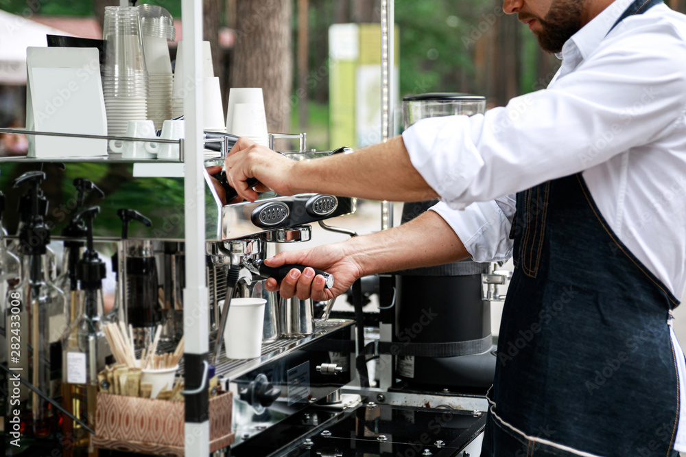 Barista making coffee using professional espresso machine Barista making coffee using professional espresso machine