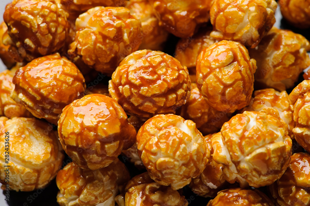 sweet Caramel Cream popcorn on the black background sweet Caramel Cream popcorn on the black background