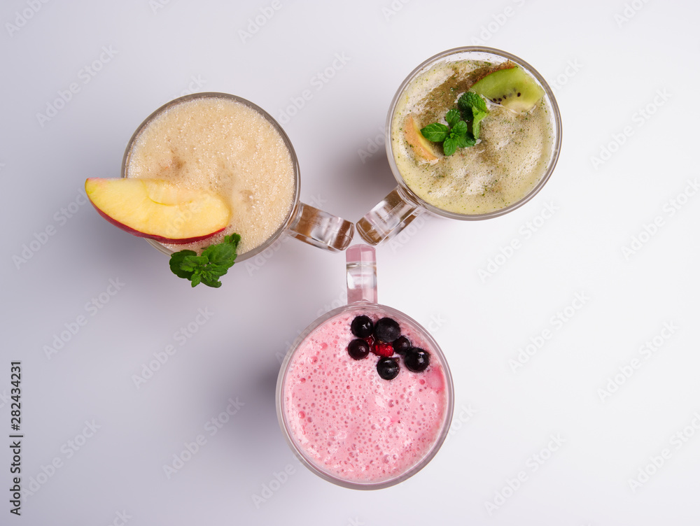 Glass of pink strawberry milkshake or cocktail isolated on white background. Glass of pink strawberry milkshake or cocktail isolated on white background.