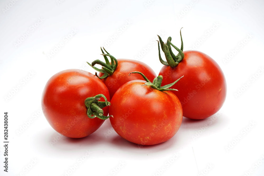 ripe fresh tomatoes isolated on white background ripe fresh tomatoes isolated on white background
