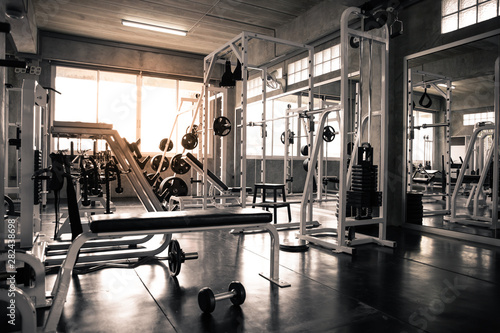 Within gym with modern fitness equipment.