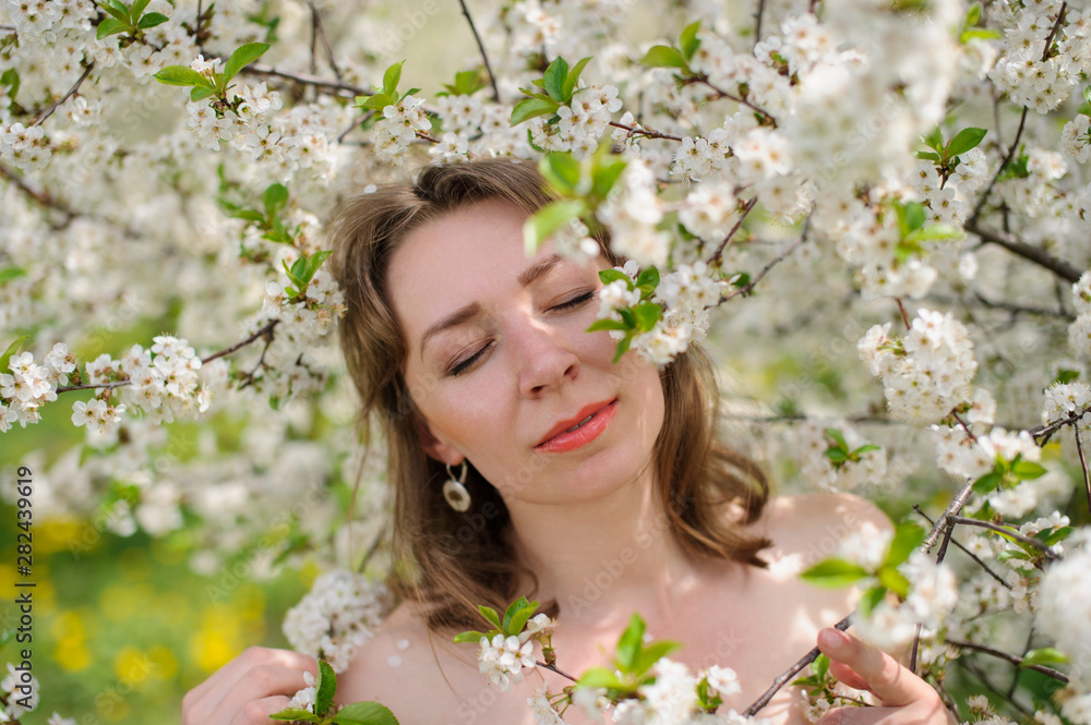 Portrait of a young woman in the garden Portrait of a young woman in the garden