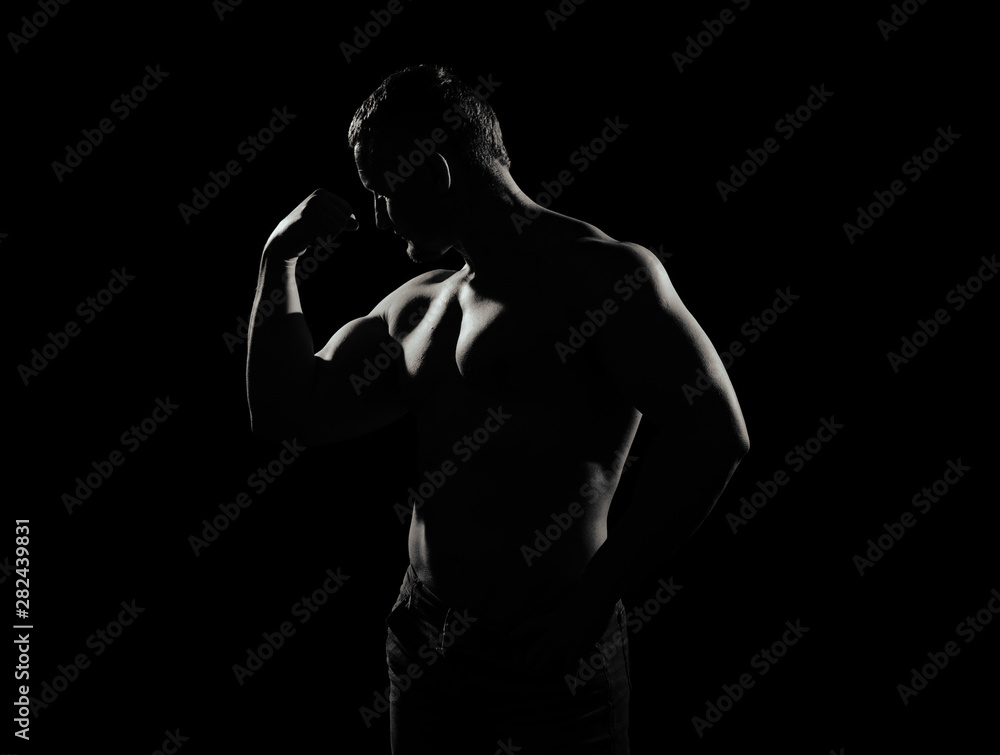 Image of muscle man posing in studio Image of muscle man posing in studio