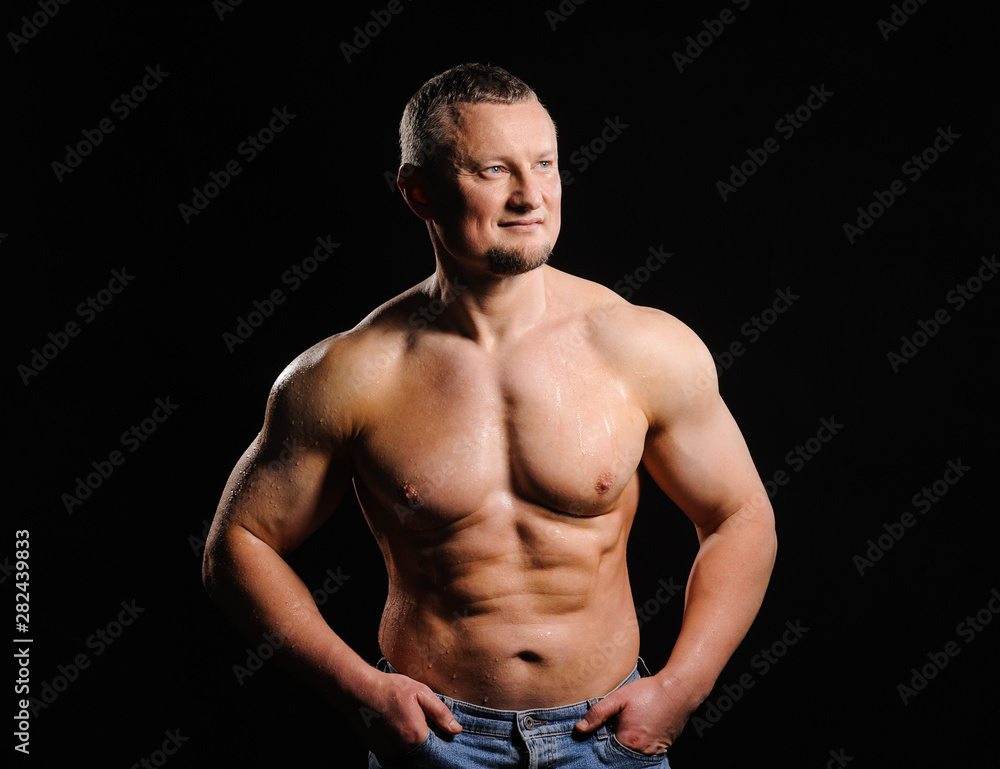Fototapeta premium Image of muscle man posing in studio