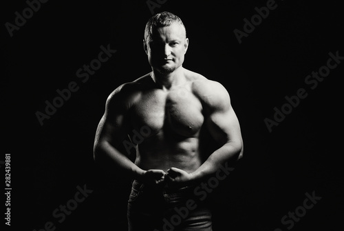 Image of muscle man posing in studio © Art_man