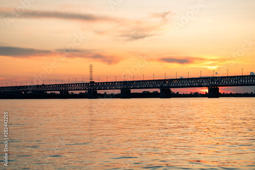 Bridge over the Amur river at sunset. Russia. Khabarovsk. Photo from the middle of the river.