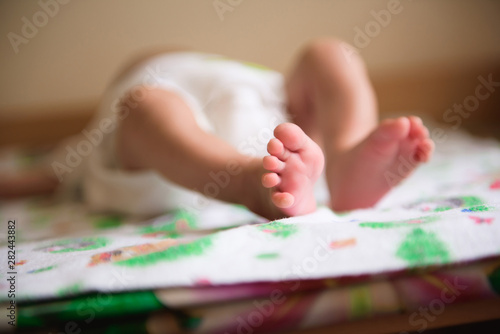 Close up of newborn baby feet. Baby. Cozy. Family.