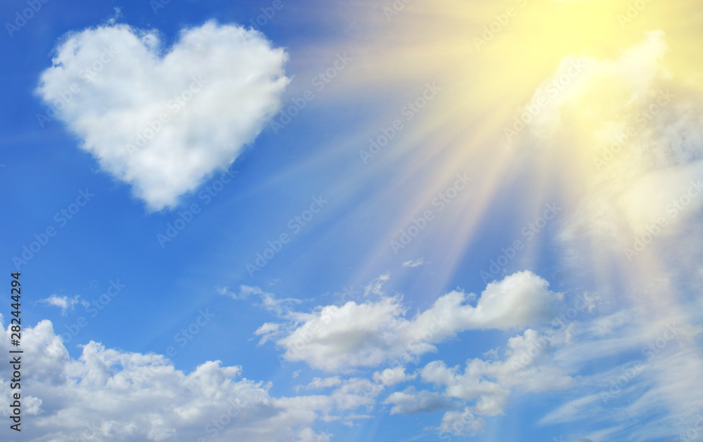 Heart shaped cloud in the blue sky and sun - obrazy, fototapety, plakaty 