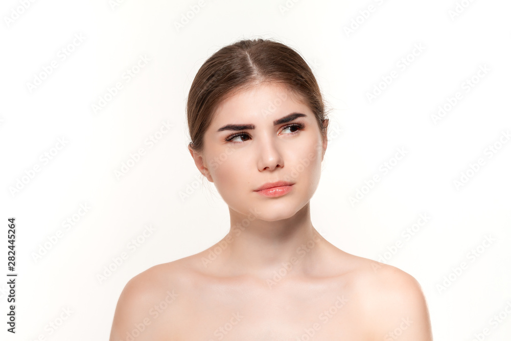 Close-up portrait of a beautiful thoughtful young girl isolated over white background. Close-up portrait of a beautiful thoughtful young girl isolated over white background.