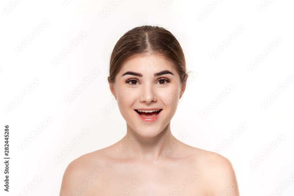Close-up portrait of a happy beautiful young girl isolated over white background. Close-up portrait of a happy beautiful young girl isolated over white background.
