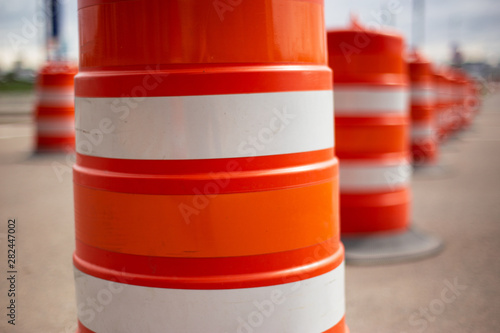 long line of orange traffic barrier