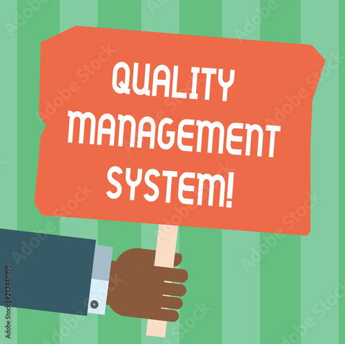 Writing note showing Quality Management System. Business photo showcasing formalized system that documents processes Hu analysis Hand Holding Colored Placard with Stick Text Space