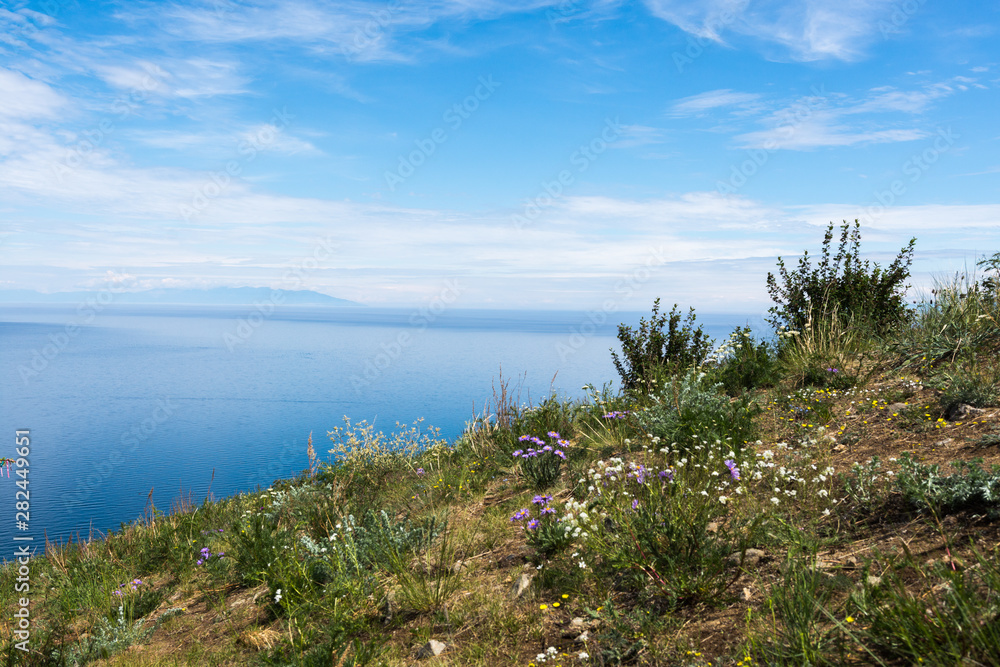 Beautiful view of Lake Baikal on a clear summer day from the shore of Olkhon Island