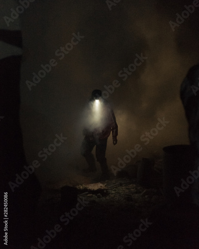 Sulpher Miner at Ijen Volcano, Indonesia photo
