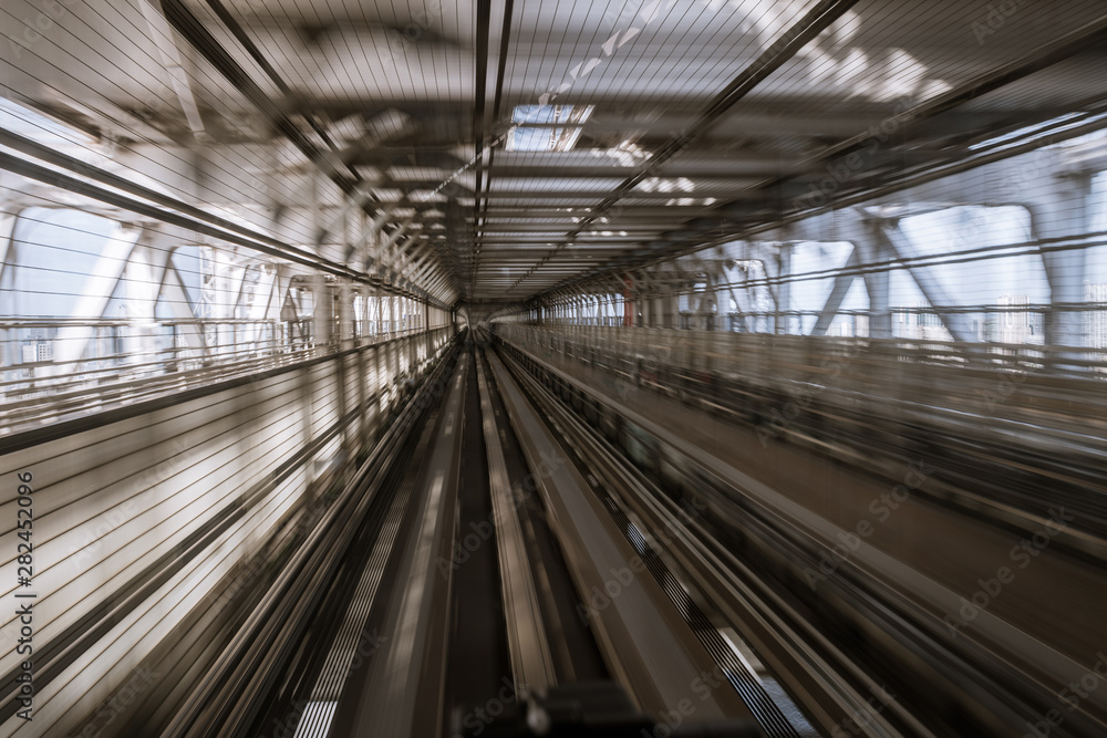 motion-blurred view from a moving train running in tunnel motion-blurred view from a moving train running in tunnel