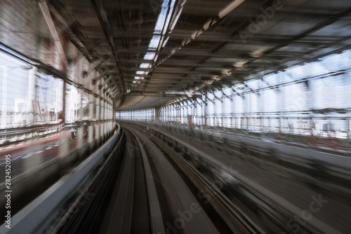 Fototapeta Naklejka Na Ścianę i Meble -  motion-blurred view from a moving train running in tunnel