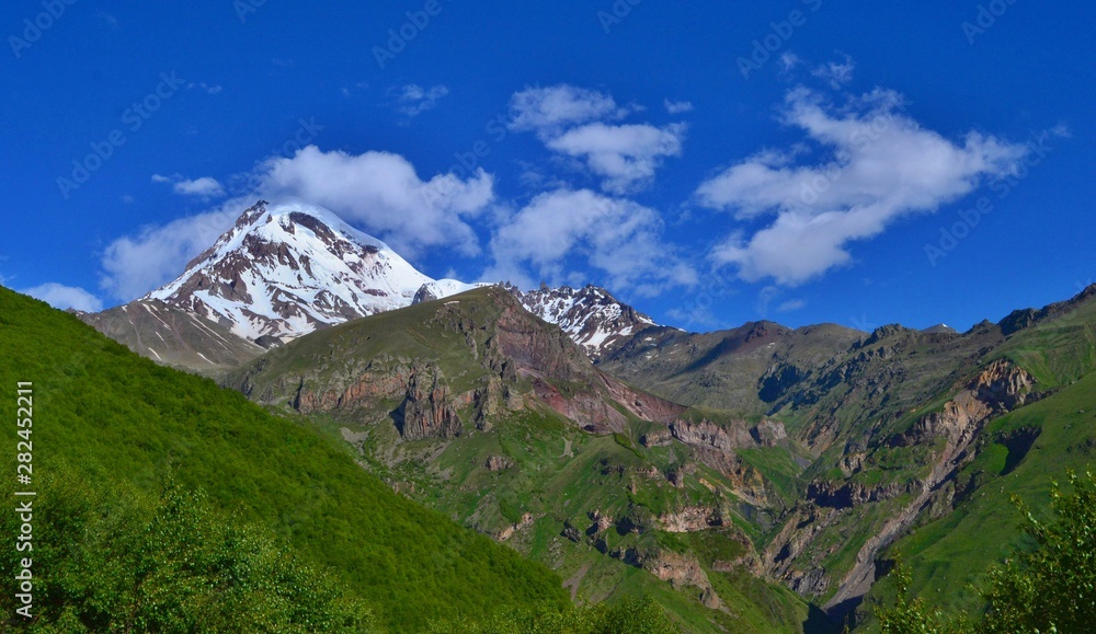 Fototapeta premium Beautiful Kazbek Mountain near Stepantsminda town. Georgian Valley.