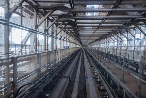 Photography tunnel of monorail road view from front window of a moving train running