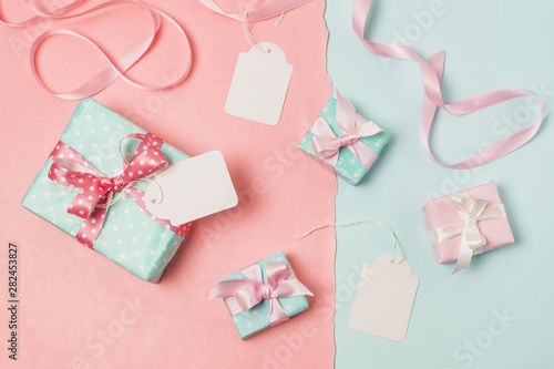 Elevated view of gifts; blank tags and ribbon