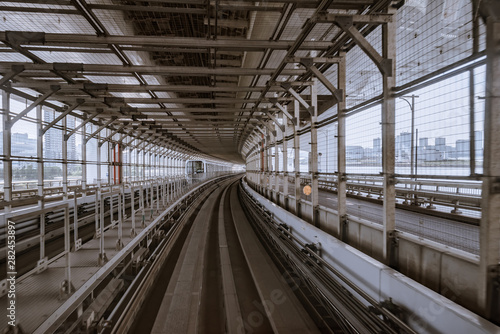 tunnel of monorail road view from front window of a moving train running