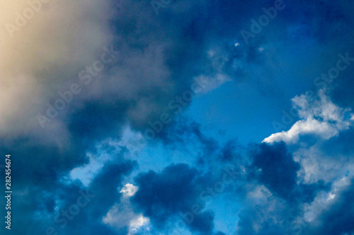 blue sky with clouds and sun