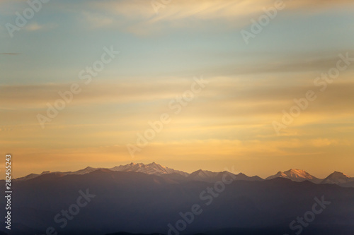 Photo of evening mountain landscape with red sky
