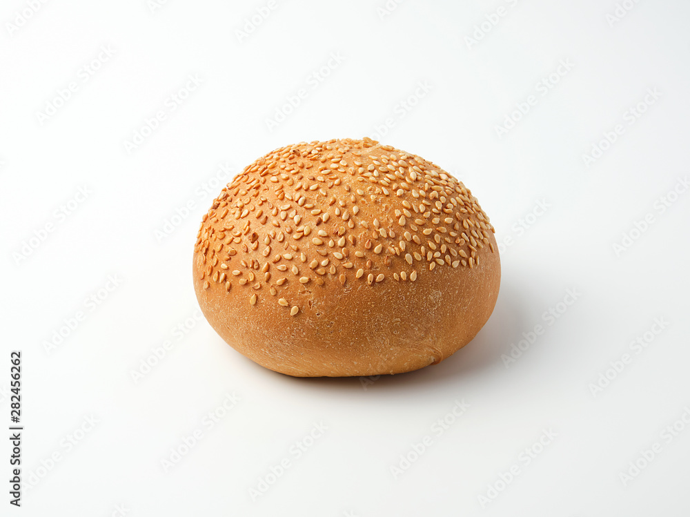 baked whole round bun with sesame seeds made from white wheat flour baked whole round bun with sesame seeds made from white wheat flour