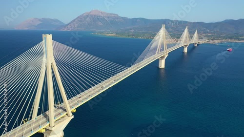 Aerial drone video of world famous cable suspension bridge of Rio - Antirio Harilaos Trikoupis, crossing Corinthian Gulf, mainland Greece to Peloponnese, Patras photo