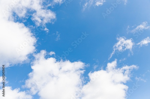 Blue sky background. Beautiful sky with white clouds. Copy space