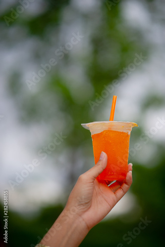 Hands and delicious orange juice For drinking healthy food drink ideas