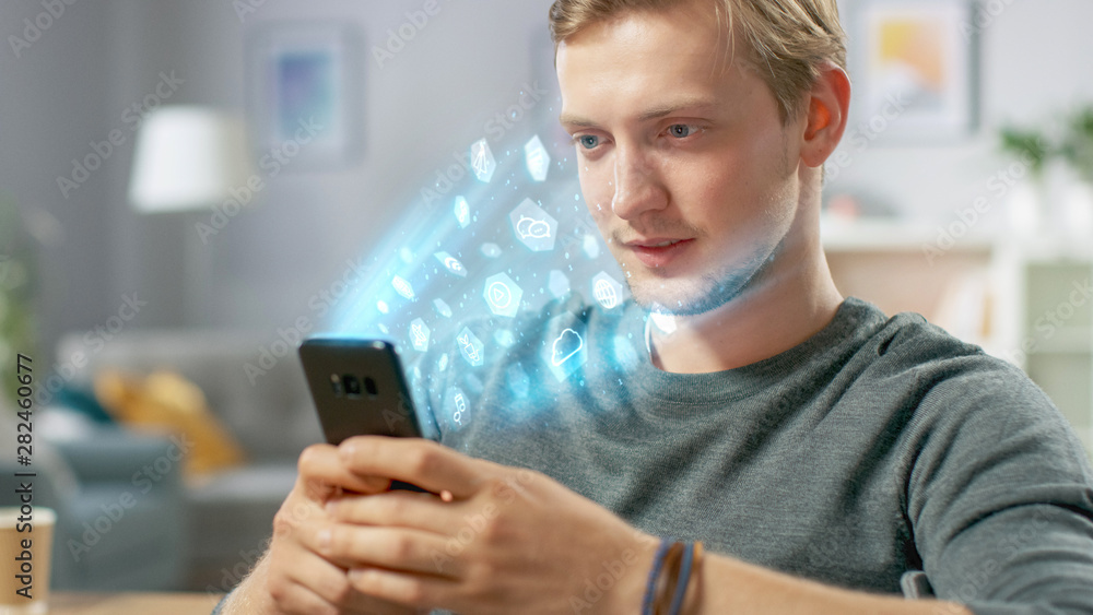 Visual Effect of Connecting and Surfing the Web with Illustrative Icons and Symbols. Handsome Young Man Uses Smartphone in His Living Room. Browsing in Internet and Social Networks, Relaxing at Home. Visual Effect of Connecting and Surfing the Web with Illustrative Icons and Symbols. Handsome Young Man Uses Smartphone in His Living Room. Browsing in Internet and Social Networks, Relaxing at Home.