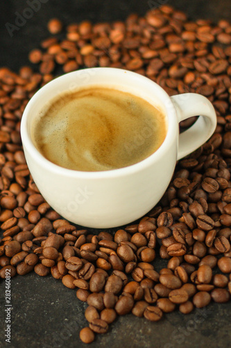 coffee freshly brewed in a white cup serving of beverage (coffee grain). food. top. copy space