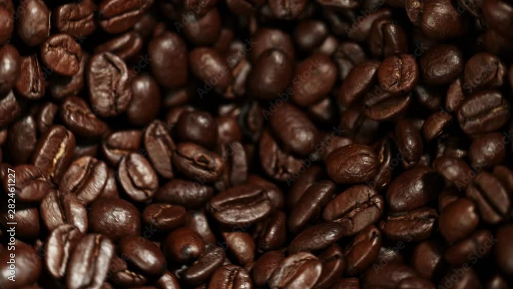 Super Slow Motion Shot of Rotating Coffee Beans in the Grinder at 1000fps. Super Slow Motion Shot of Rotating Coffee Beans in the Grinder at 1000fps.