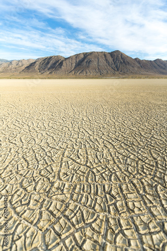 Cracked playa mud texture leading out to the mountains on the Black Rock desert © ecummings00