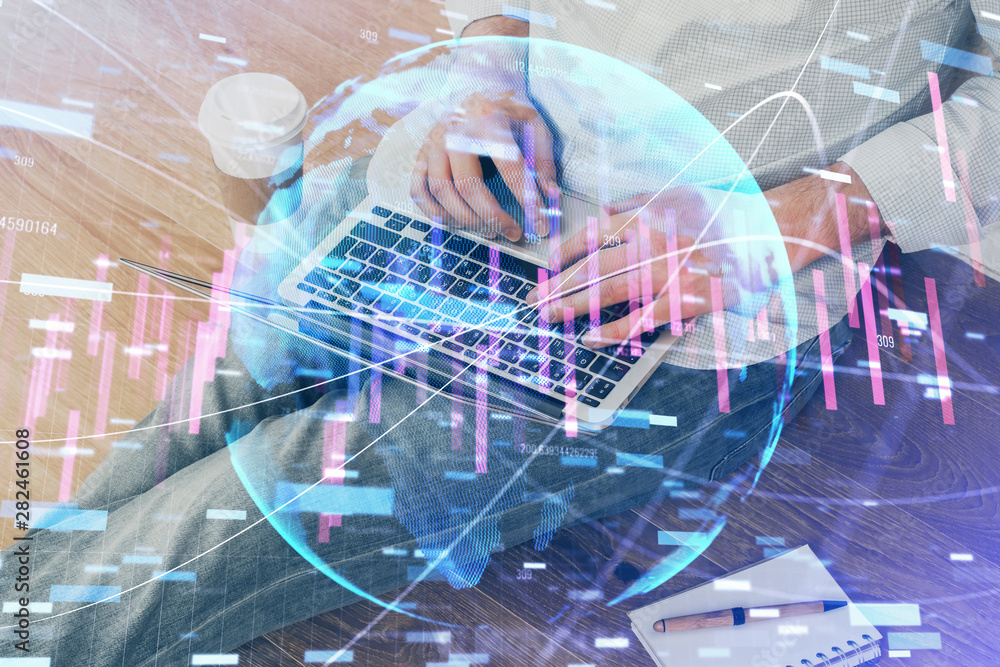Forex graph with businessman working on computer in office on background. Concept of analysis. Double exposure. Forex graph with businessman working on computer in office on background. Concept of analysis. Double exposure.