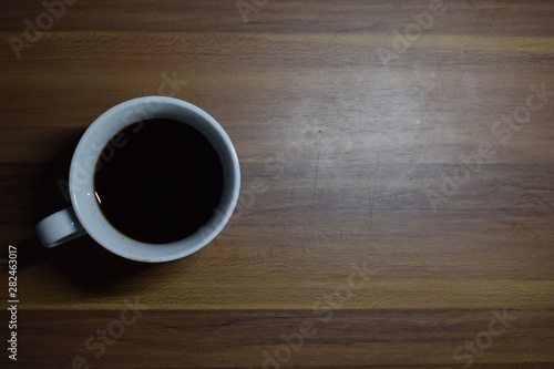 A Cup Of Coffee at Wooden Table Texture
