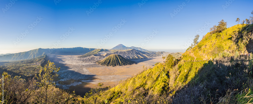Sunrise at the Bromo Tengger Semeru National Park on the Java Island, Indonesia. View on the Bromo or Gunung Bromo on Indonesian, Semeru and other volcanoes located inside of the Sea of Sand within