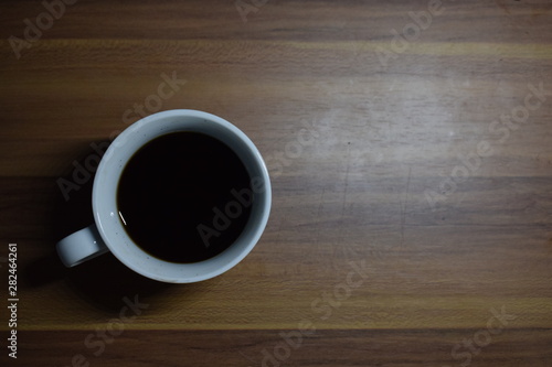 A Cup Of Coffee at Wooden Table Texture