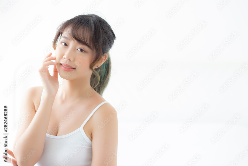 Portrait of beautiful young asian woman smile while wake up healthy and wellness with sunrise at morning in the bedroom, asia girl skin care with happy with fresh, lifestyle and relax concept. Portrait of beautiful young asian woman smile while wake up healthy and wellness with sunrise at morning in the bedroom, asia girl skin care with happy with fresh, lifestyle and relax concept.