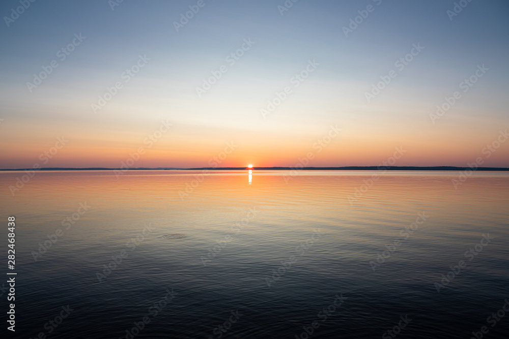 Calm serene sunrise lake scenery
