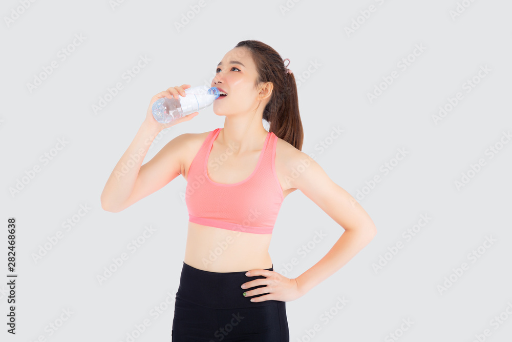 Beautiful young asian woman fit shape drinking water after workout and exercise isolated on white background, girl thirsty after aerobic tired for refresh, model fitness healthy and wellness concept. Beautiful young asian woman fit shape drinking water after workout and exercise isolated on white background, girl thirsty after aerobic tired for refresh, model fitness healthy and wellness concept.