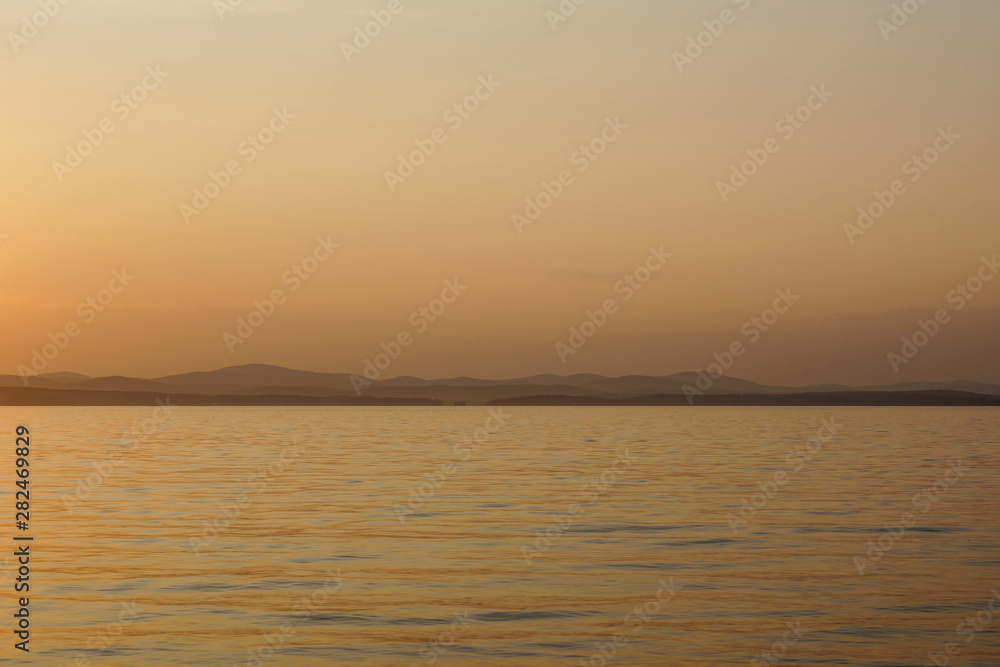 Fototapeta premium Red sunset on the lake