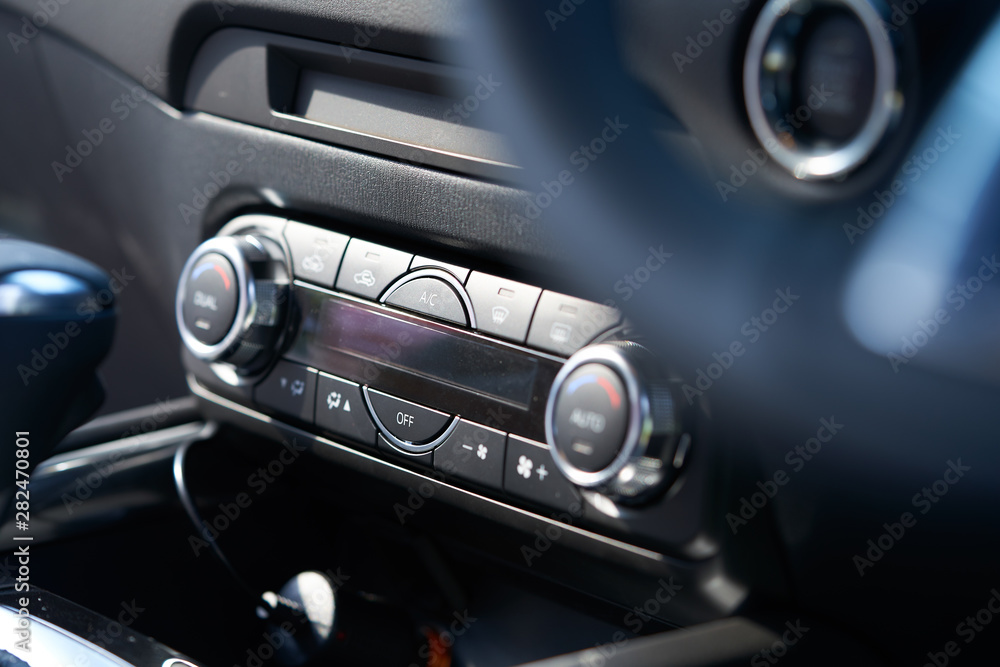 Vehicle interior of a modern car with air conditioner controller Vehicle interior of a modern car with air conditioner controller