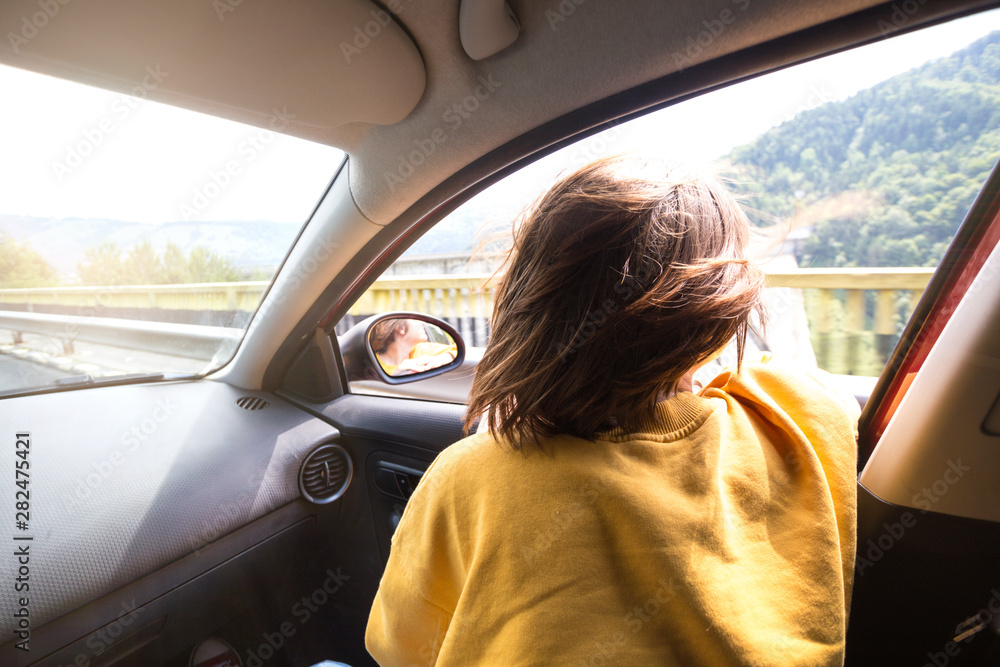 girl traveling in a car